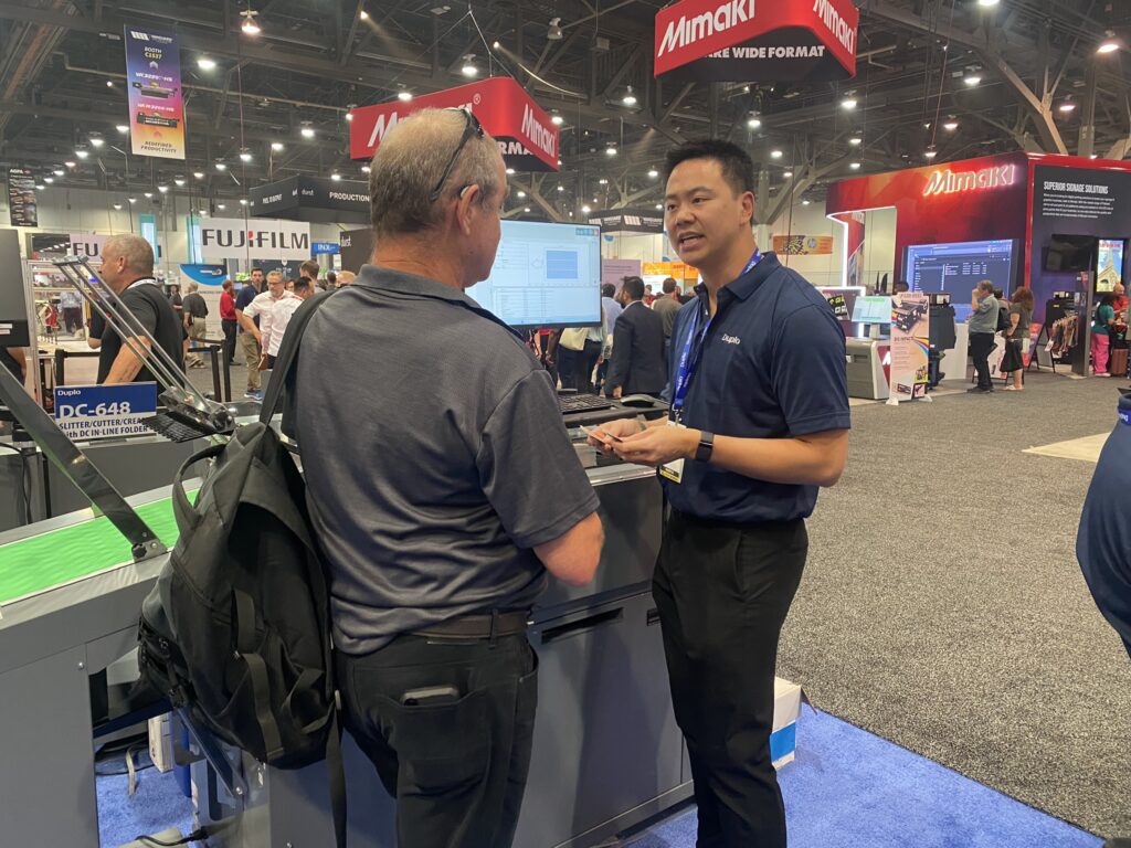 Kevin Chen at Duplo booth, Printing United 2025